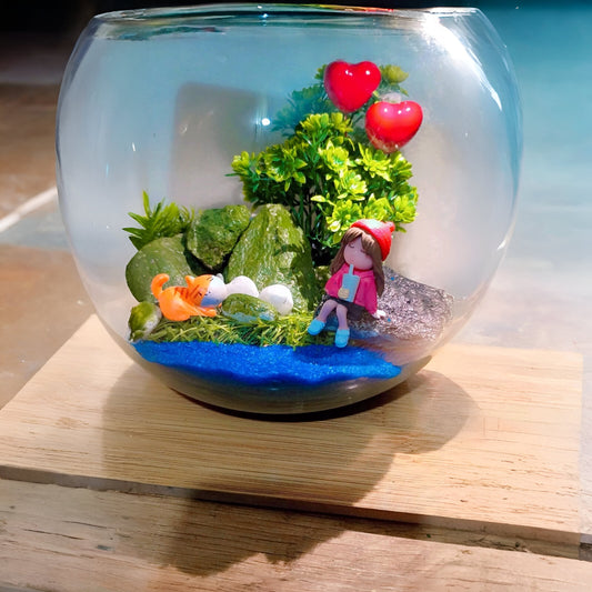 DIY terrarium kit featuring a girl figurine by a lake
